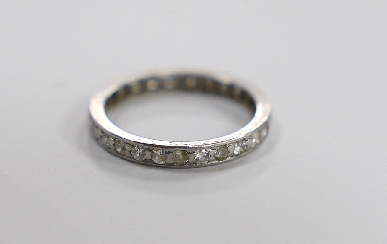 A white metal and diamond set full eternity ring, size N, gross weight 3 grams.